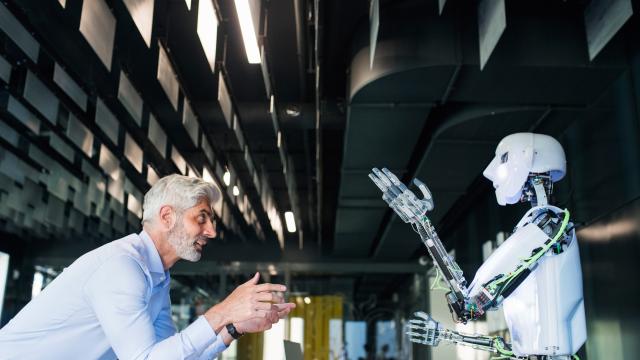 image of a businessman or a scientist with robot